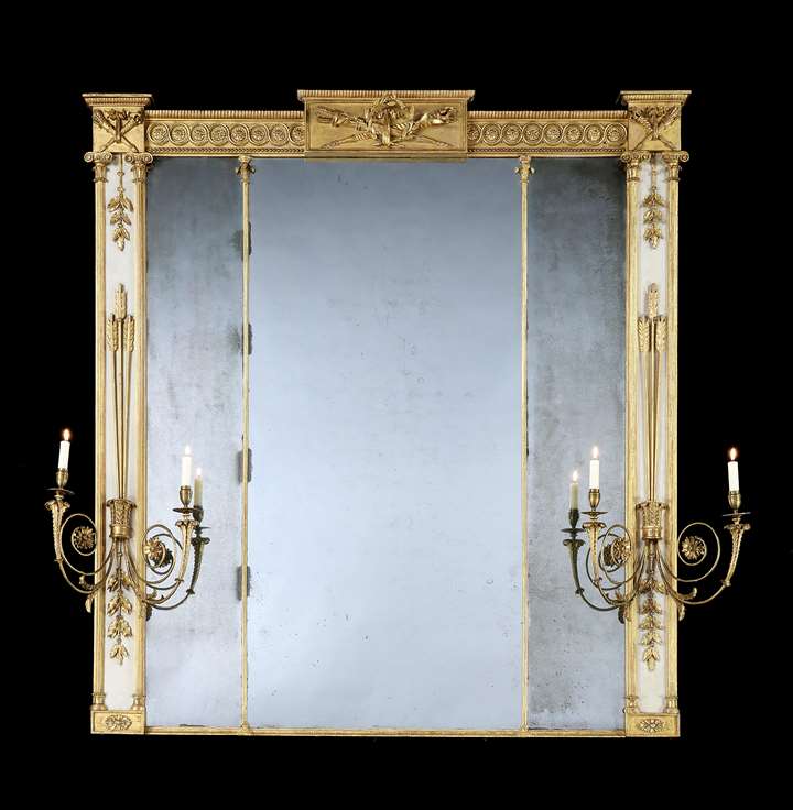 A George III carved giltwood and cream painted overmantel mirror
